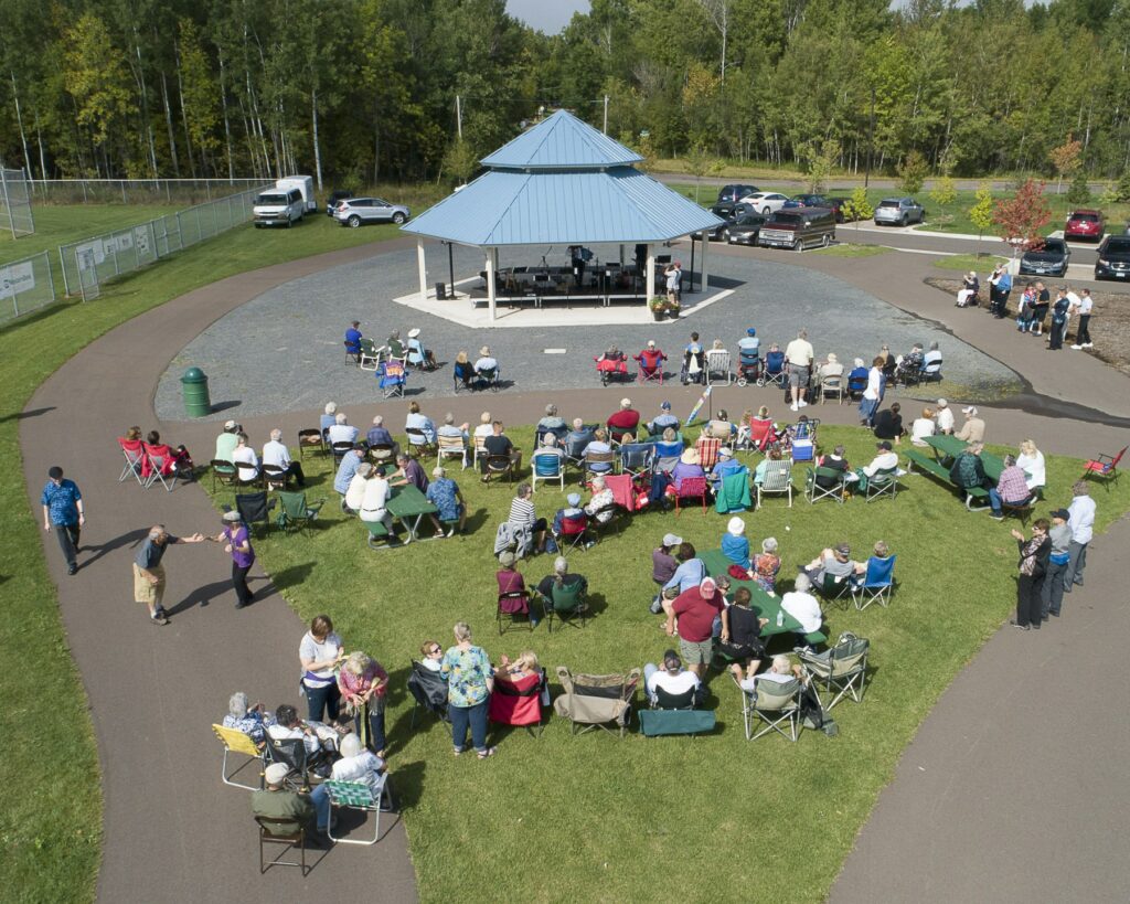 An aerial view of a group of people watching a concert at the Pavilion at GND REC